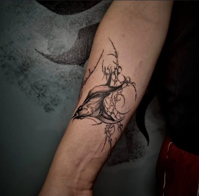 Abstract blackwork design with soft shading on the forearm