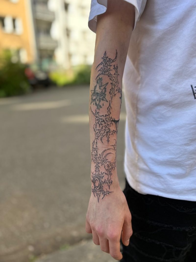 Delicate ornamental tattoo on the forearm, from elbow to wrist